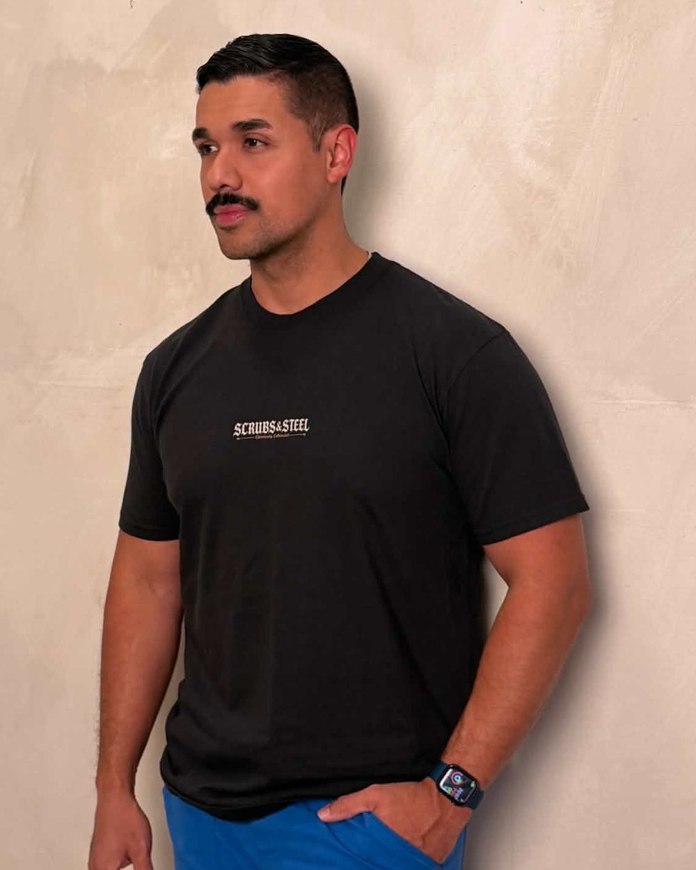 Gene Dinh, ICU nurse and founder of Scrubs and Steel, in the black tee
