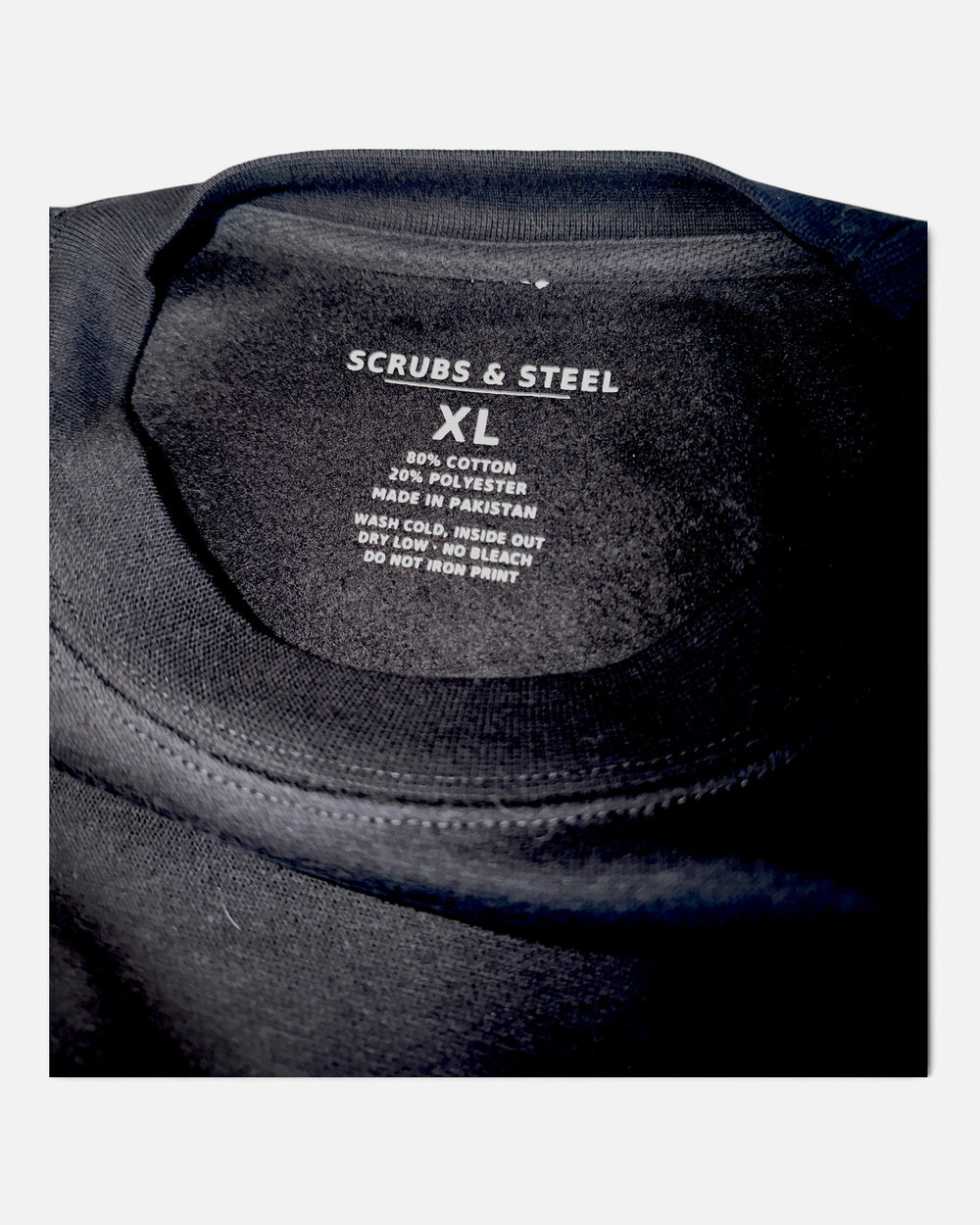 Scrubs and Steel printed neck label inside the crewneck showing size XL, 80% cotton 20% polyester