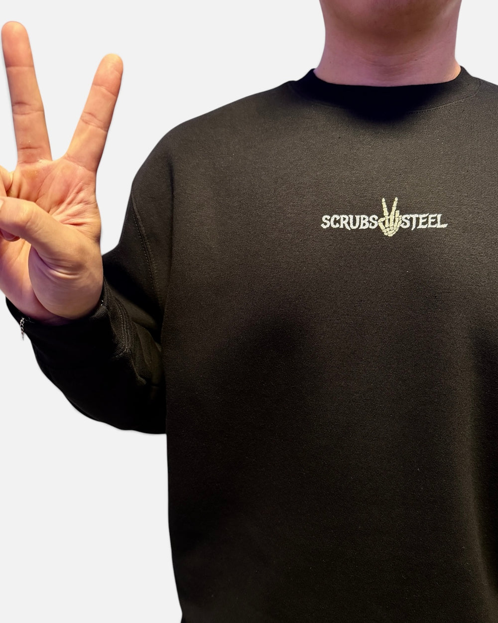 Front chest view of the Scrubs and Steel wordmark on the oversized crewneck