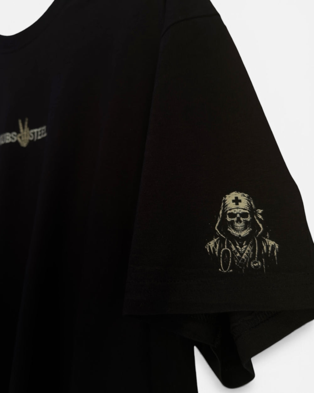 Close-up of hooded skeleton nurse sleeve print on black tee