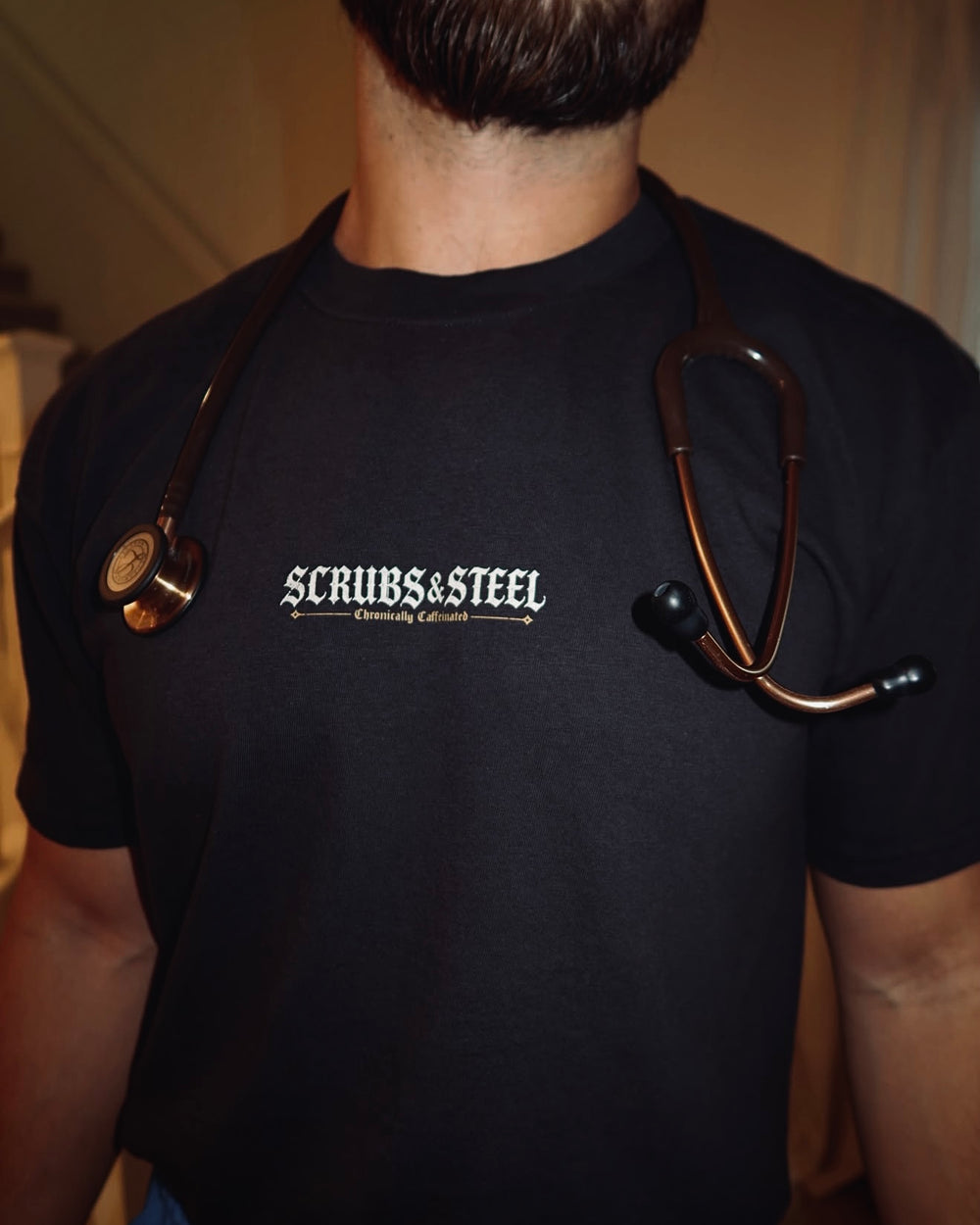 Coffee IV Nurse Tee — boxy oversized fit on heavyweight black cotton, hand-pressed by an ICU nurse