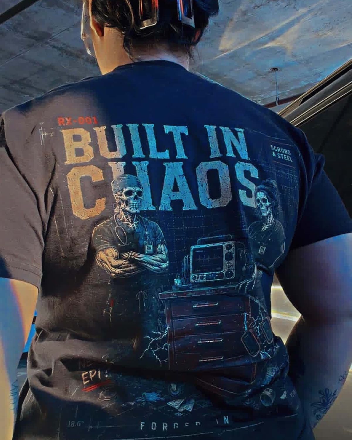 RX-001 Built in Chaos back print worn on an escalator