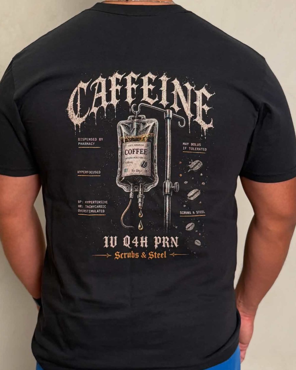 Back print in cream ink on a black tee, shown from behind